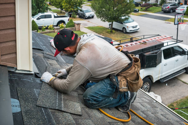 Professional Roofing technician working in Log Lane Village, CO